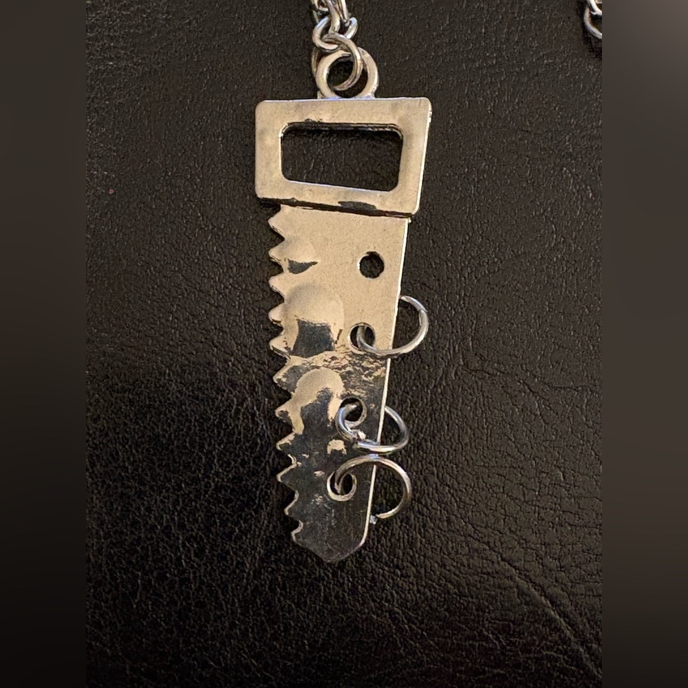 Silver Tone Saw Blade Pendant Necklace